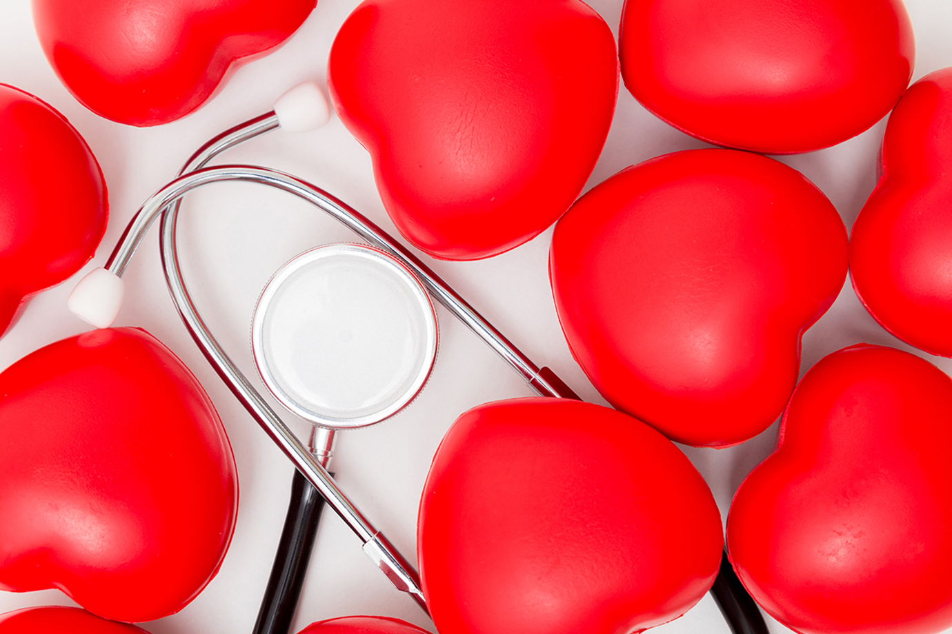 Red heart and a stethoscope. Isolated on white background. Studio lighting. Concept for healthy and medical